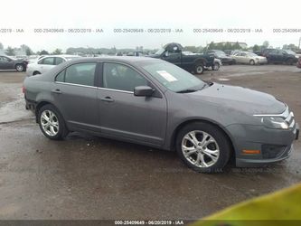 2012 Ford Fusion, 4 Cyl - auto, CLEAN TITLE- runs and drives - qt panel has damage- needs rear bumper cover