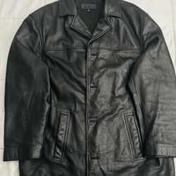 The item shown in the image is a men's black leather trench coat jacket by the brand John Ashord XL Size 