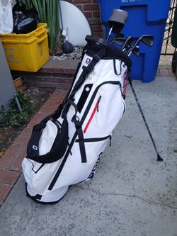 Golf Bag, Clubs, Balls, and Tees.