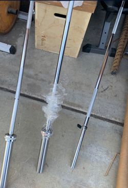 Brand new Olympic barbells and weight plates