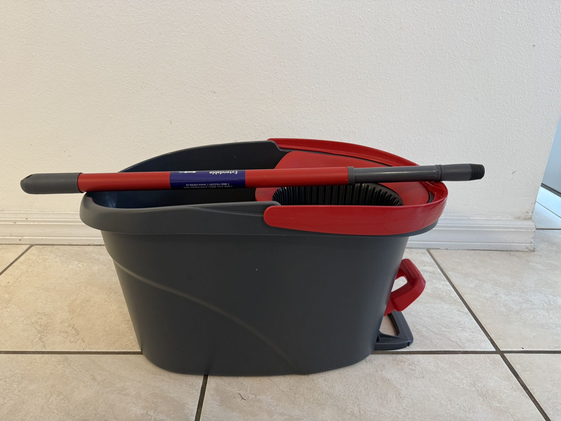 Bucket with a stick without a brush