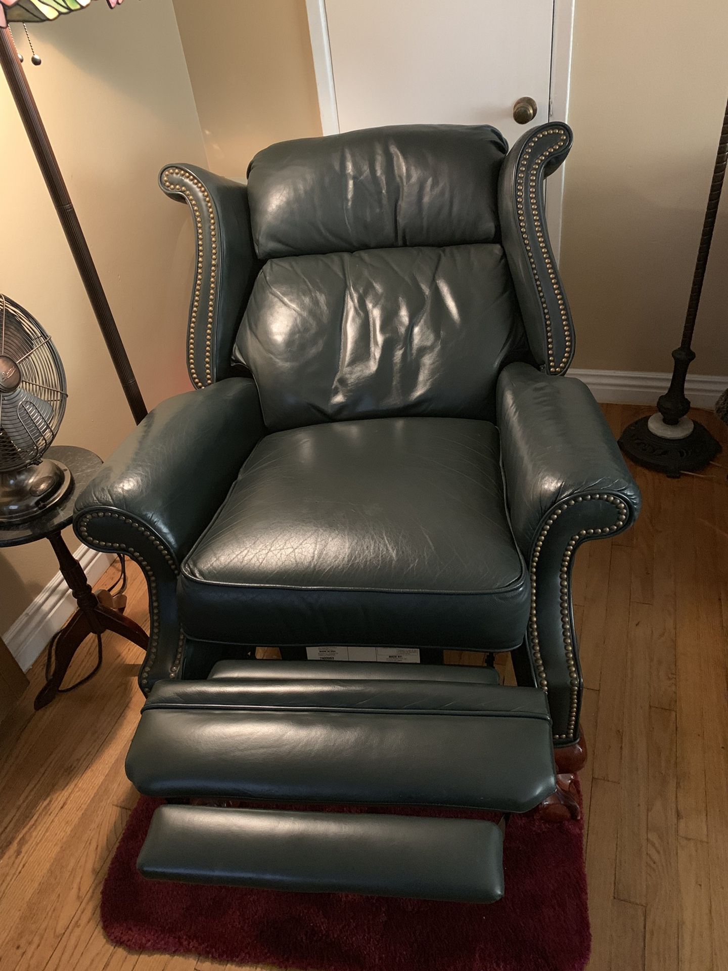 Gorgeous hunter green leather recliner with nailhead detail & ball claw feet