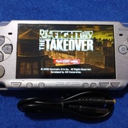PSP Sliver With Charger And Games Inside 