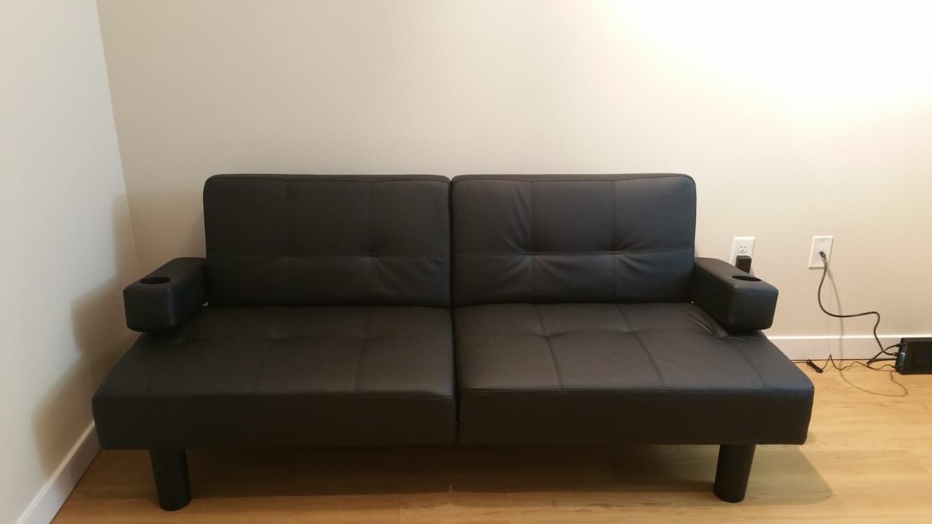 Black Faux leather futon (sofa convertible to bed)