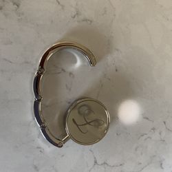 Folding hand bag hangar