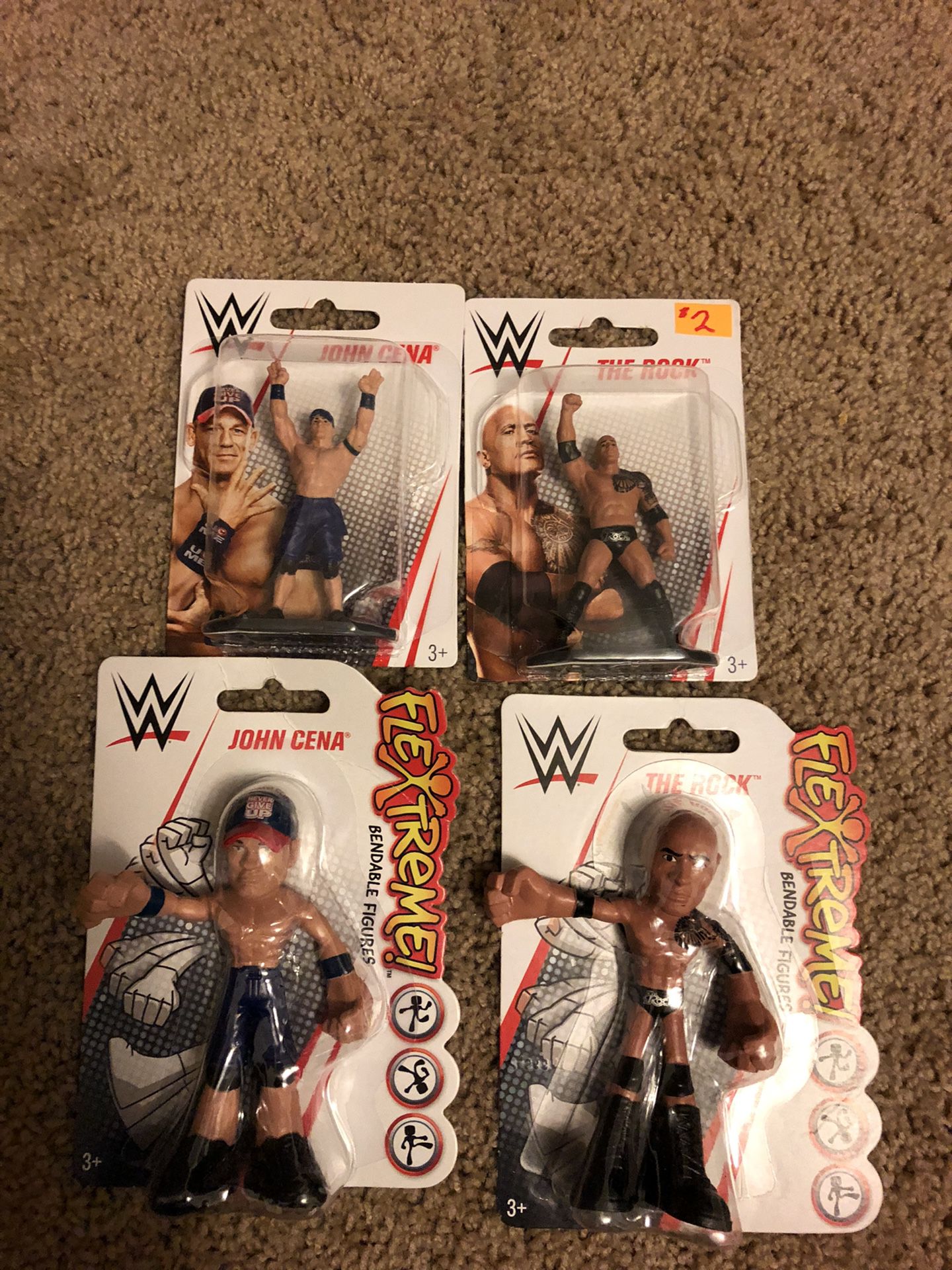 Four different wrestling figures