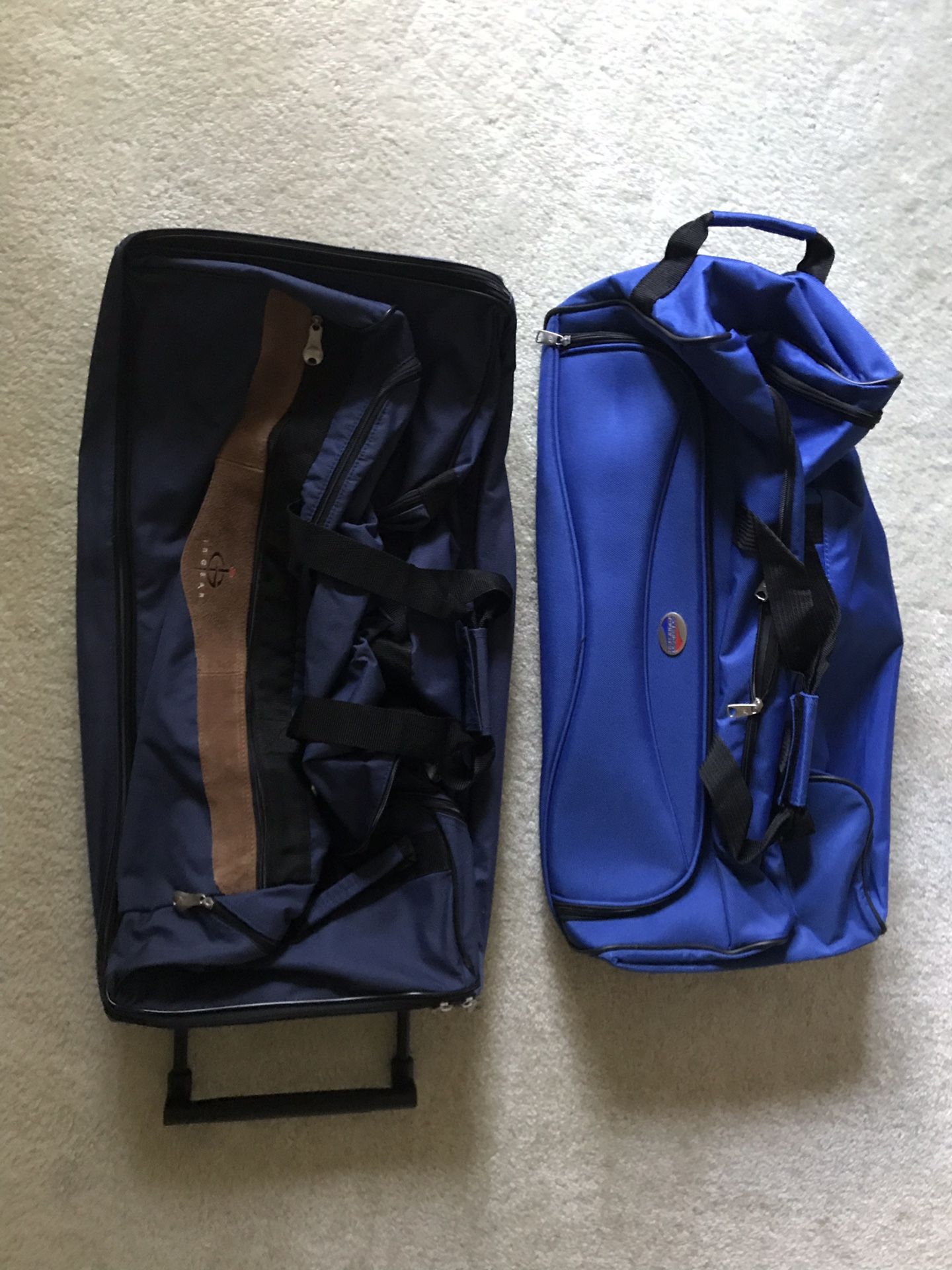 Two duffle bags on wheels