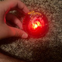 A lighting blue and red Batman bouncy ball