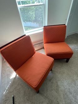 Contemporary / transitional lounge chairs with mid-century influence.