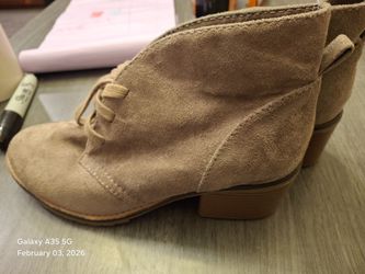 This is a pair of Merona tan faux suede lace-up ankle boots in size 7.5