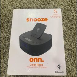 ONN clock radio with wireless charging and Bluetooth speaker