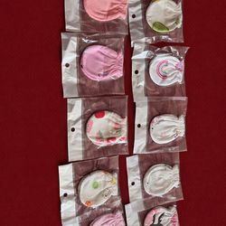 New born never used mittens in blue and pink