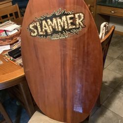 Slammer skim tuff skim board used good condition wooden skim board.   Solid Good Looking Boogie Board
