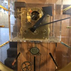 HOWARD MILLER LUCITE/BRASS CLOCK