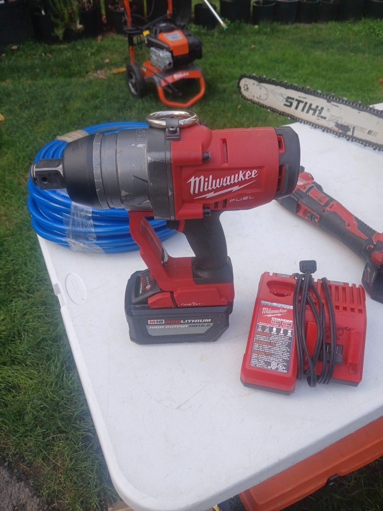Milwaukee Fuel 1-inch impact With 12.0, battery and charger. $900