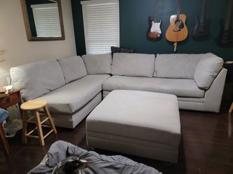 Ashley Furniture 2 piece sectional and ottoman w/ storage