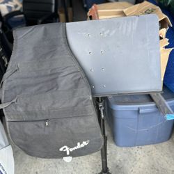 Guitar Case and Music Stand.