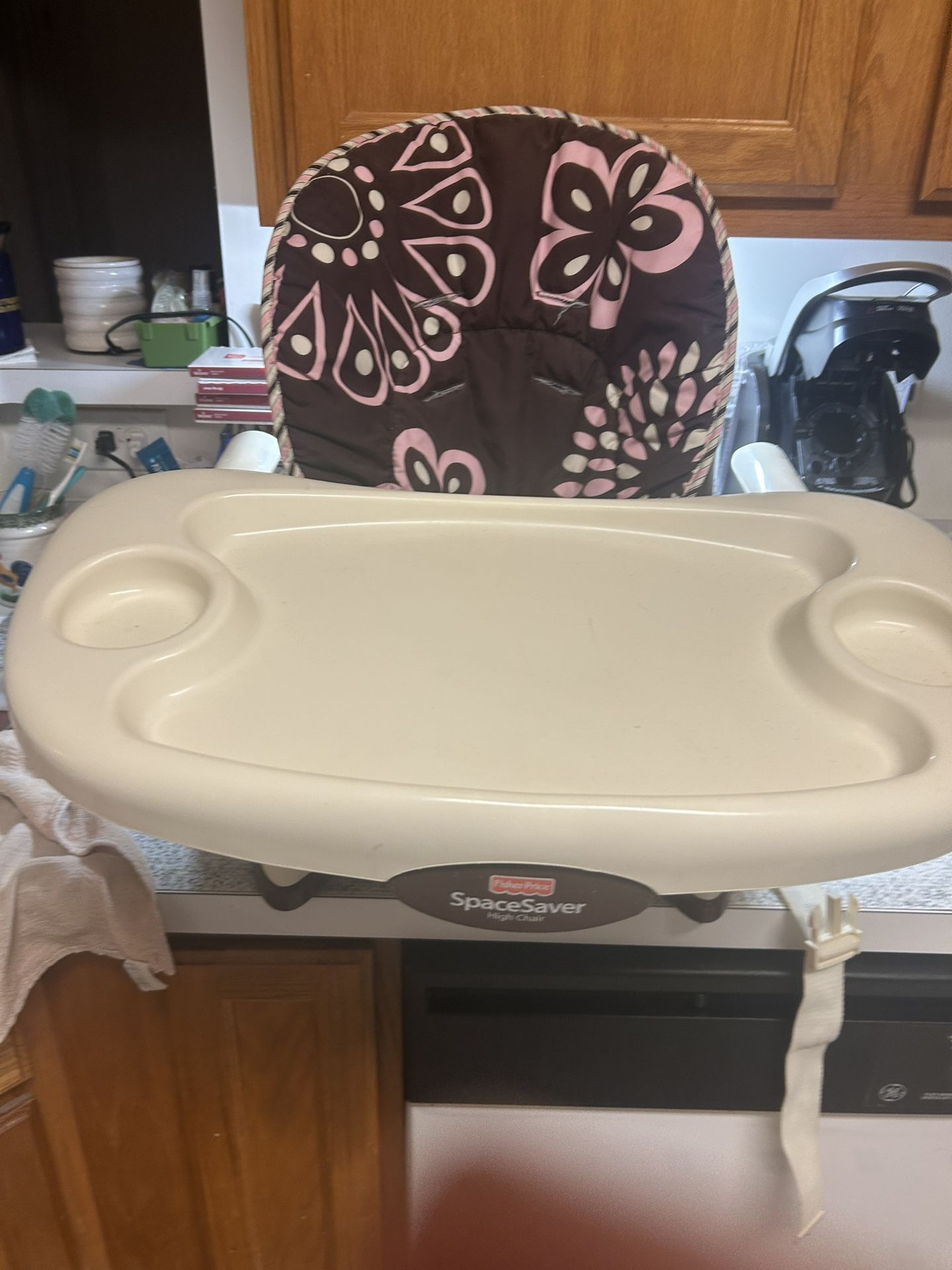 This is a Fisher-Price SpaceSaver High Chair.