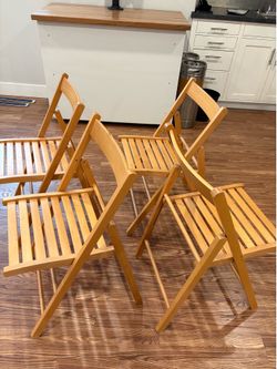 4 wooden folding chairs