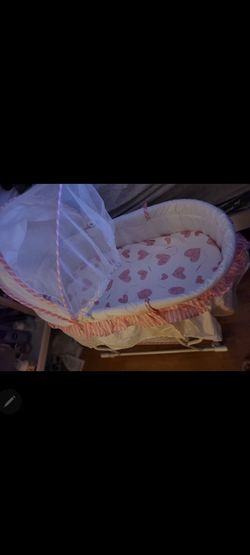 Pink baby bassinet