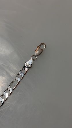 this is a 925 sterling silver Figaro chain necklace, 21 inch