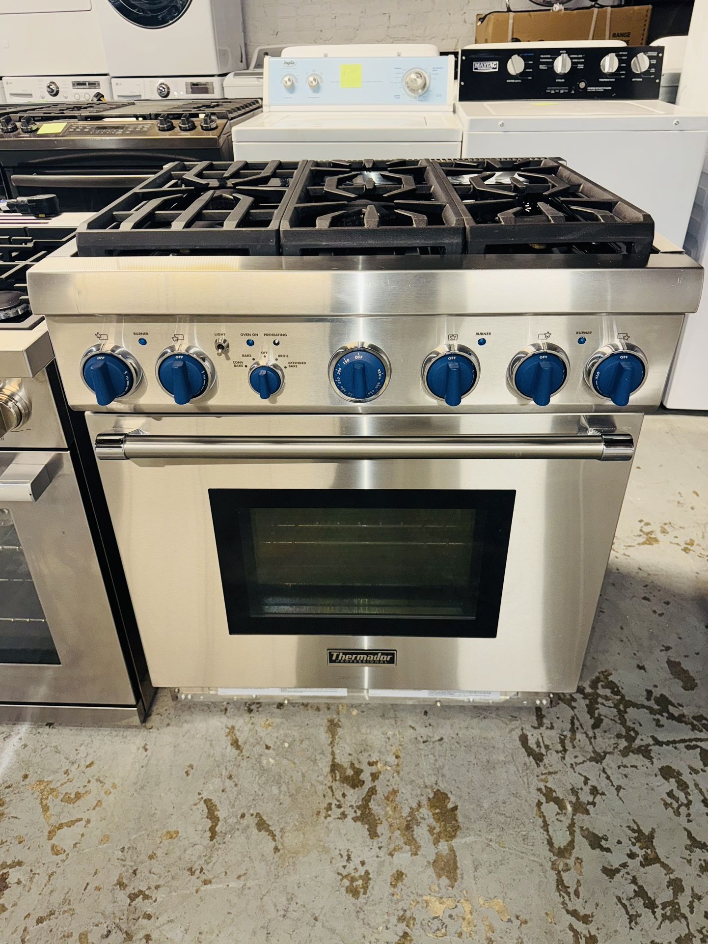 Thermador natural gas range, 30 inches wide—includes a receipt for a 90-day warranty.