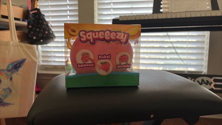 Squeeezy peach squishy and a needoh fuzzball