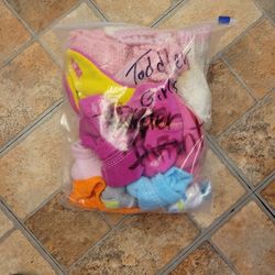 A Bag Of Toddler Hats And Gloves