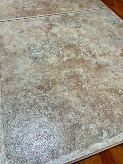 Over 320 Vinyl Flooring Tiles (16” x 16” each)