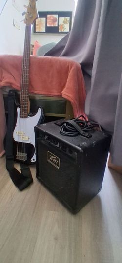 Beginner bass guitar amp and guitar holder for wall