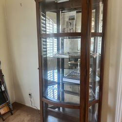 Curio cabinet with curved glass
