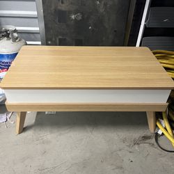 Coffee table with telescoping top 