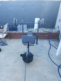 Weider Weight Bench with Barbell and Plates
