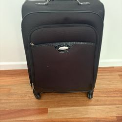Black Samsonite Luggage on 4 swivel casters