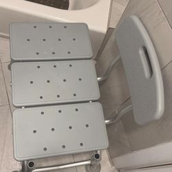 Selling a gray bath or shower chair that comes with a backrest. It's in good condition and ready to use in your bathroom!