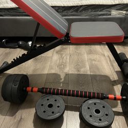 Barbell With Weights And A Bench 