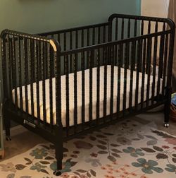 Black wooden crib