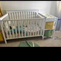 Standard Size Crib With Attached Changing Table As Well As New Mattress And New Sheets 