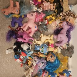 Collection of various plush toys and dolls, including baby dolls and accessories. 50 items for $50