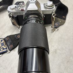Canon AV-1 35mm film camera paired with Canon FD 70-210mm f/4 manual focus lens
