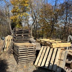Wooden Pallets of various sizes for stacking wood, upcoming project or what have you.
