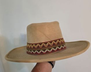 Faux-Suede Western Cowboy Hat from "The Duke Collection"55% Cotton-45% Rayon,[ L ] 7 ¼ -7 ⅜Tan faux-suede western hat from The Duke Collection is made