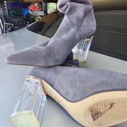 Cecelia New York: Their "Emmie" bootie features a grey suede upper and lucite heel-$150