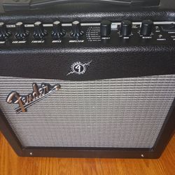 FENDER AMP, CORD AND GUITAR CABLE.