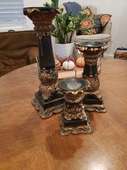 3 beautiful gold and black candle holders