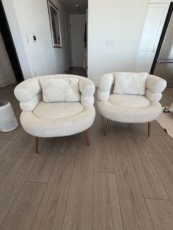 Stylish fuzzy chairs with gold legs