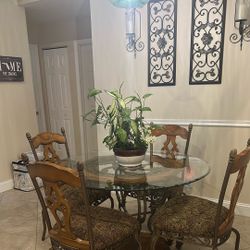 Glass Table, 4 Chairs, And 2 Barstools. 