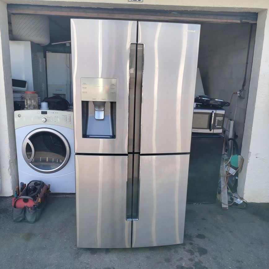 like new matching Samsung two-piece package four-door stainless fridge and stainless glass top stove will separate with warranty