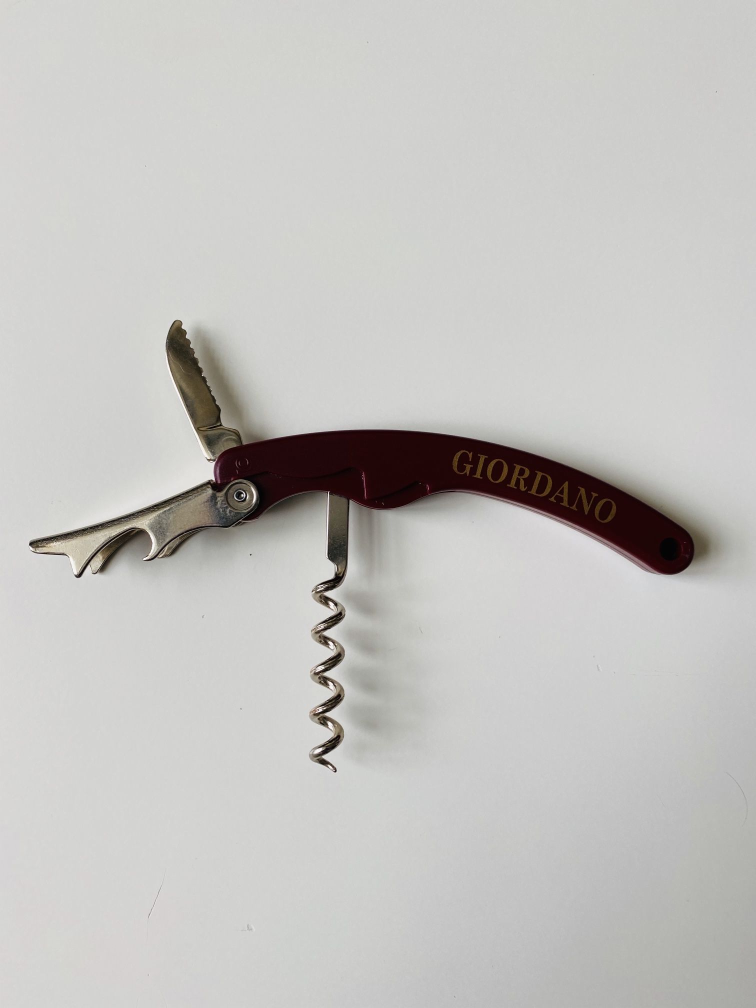 Famous Giordano Stainless Corkscrew-Bottle Opener. New. Never used. Very efficient do-it-all 3-tool instrument. Ergonomic handle. 5-turn worm. Integra