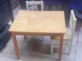 Child size table  with 2chairs.  Solid wood